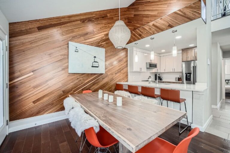 Dining table and open kitchen at 4081 Bighorn Road, a monthly rental in East Vail